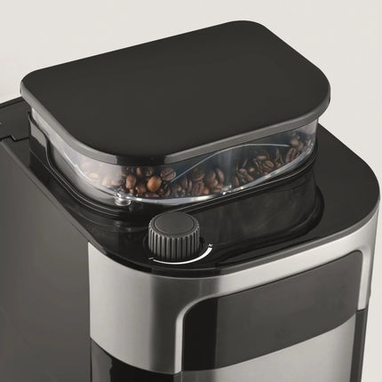 Svart kaffekvarn med kärnkaffe i bähllaren, modern design, Nordic Cookware