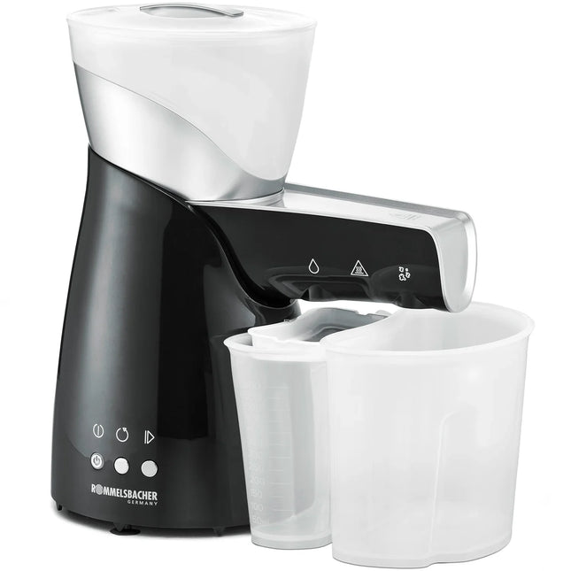 Modern köksmaskin från Nordic Cookware, svart och silver, med två vita plastbehållare.